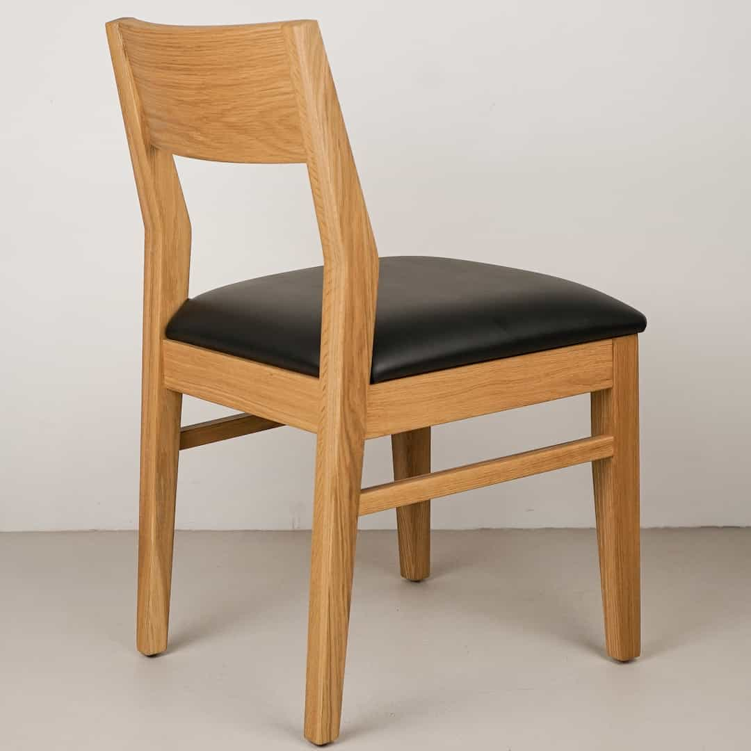 onyx faux leather seat on natural oak chair