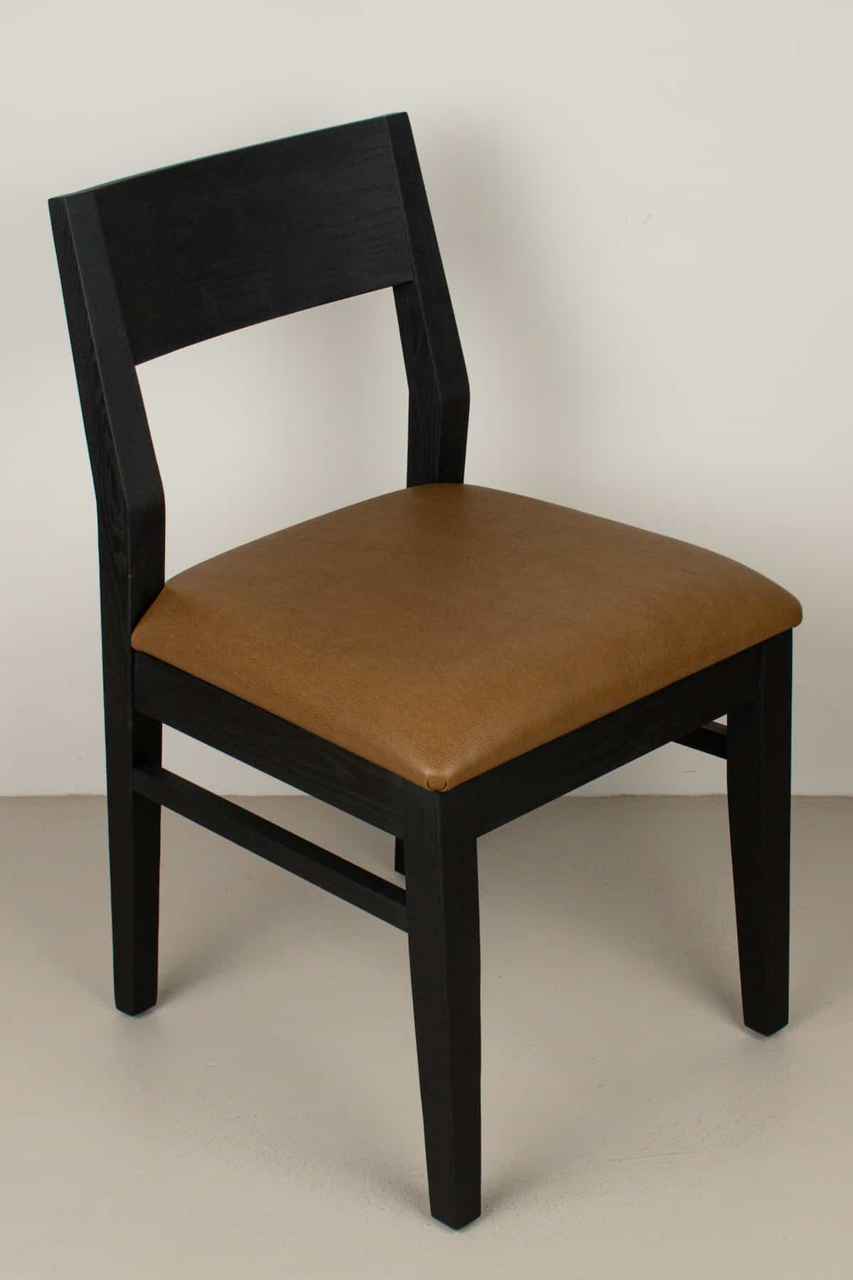 caramel faux leather seat on black oak chair