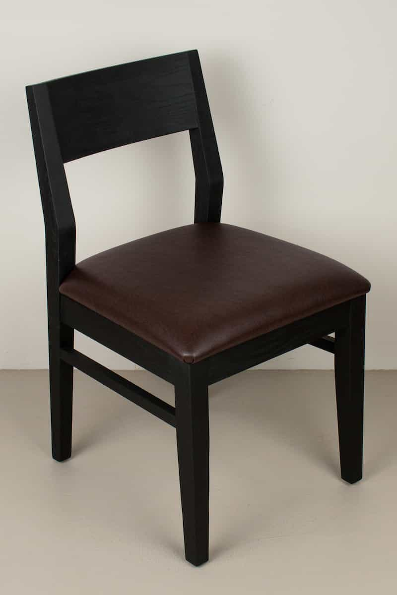 chocolate faux leather seat on black oak chair