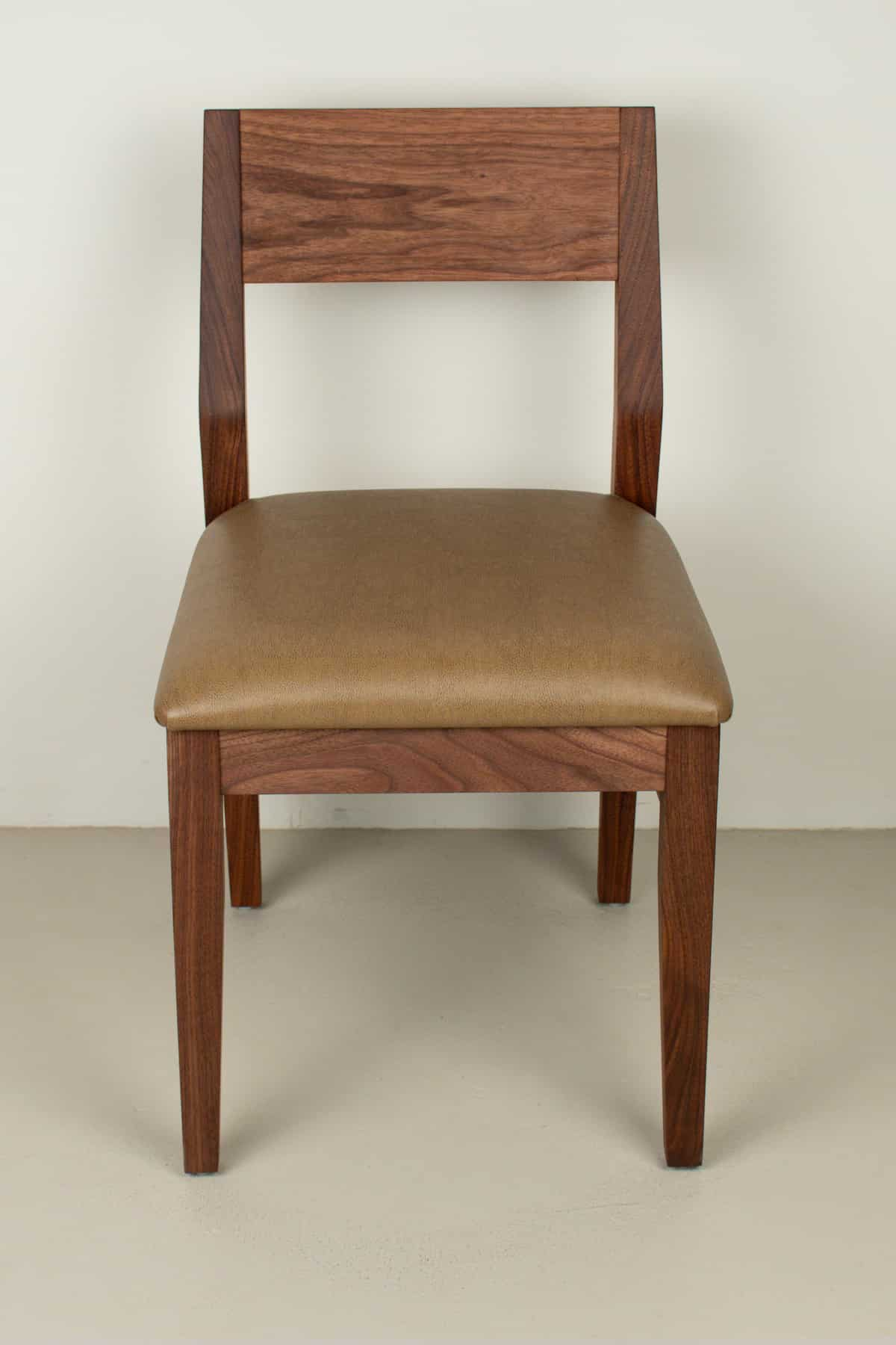 caramel faux leather seat on walnut chair