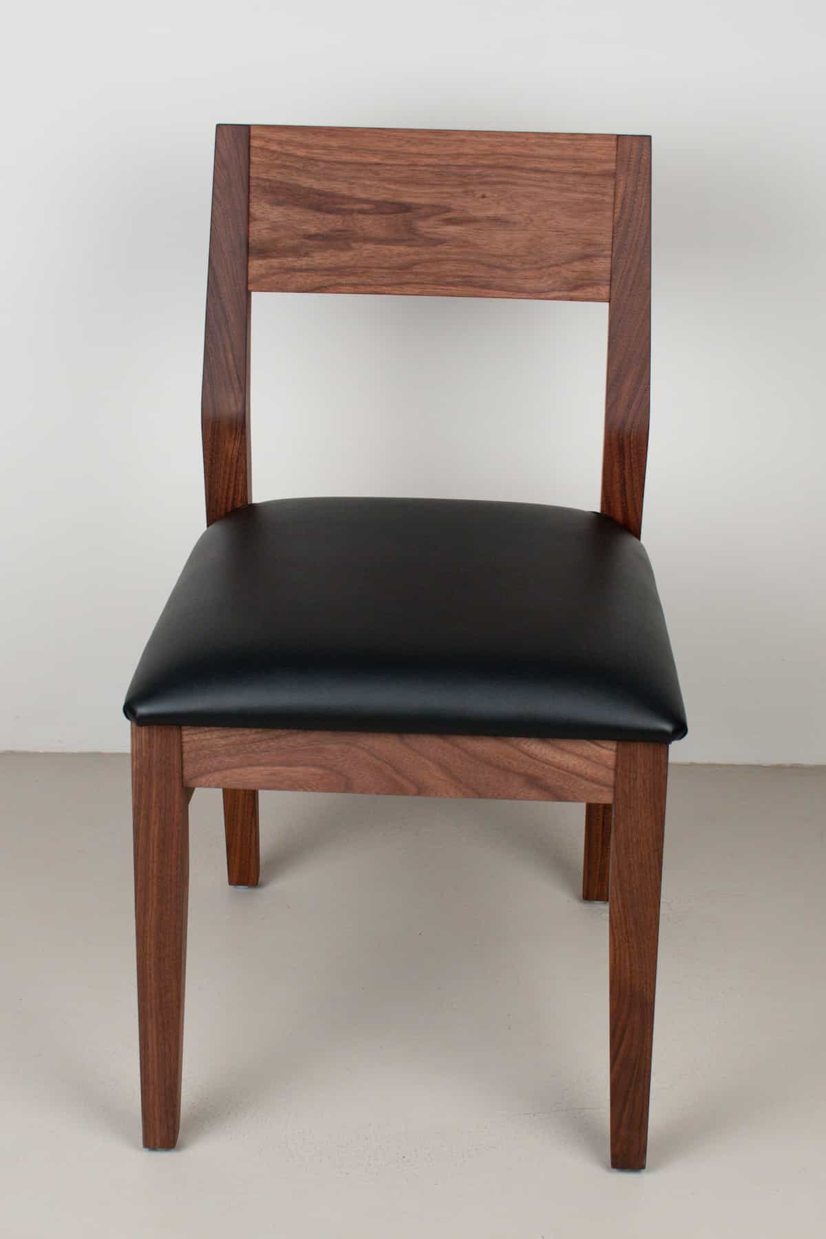 onyx faux leather seat on walnut chair