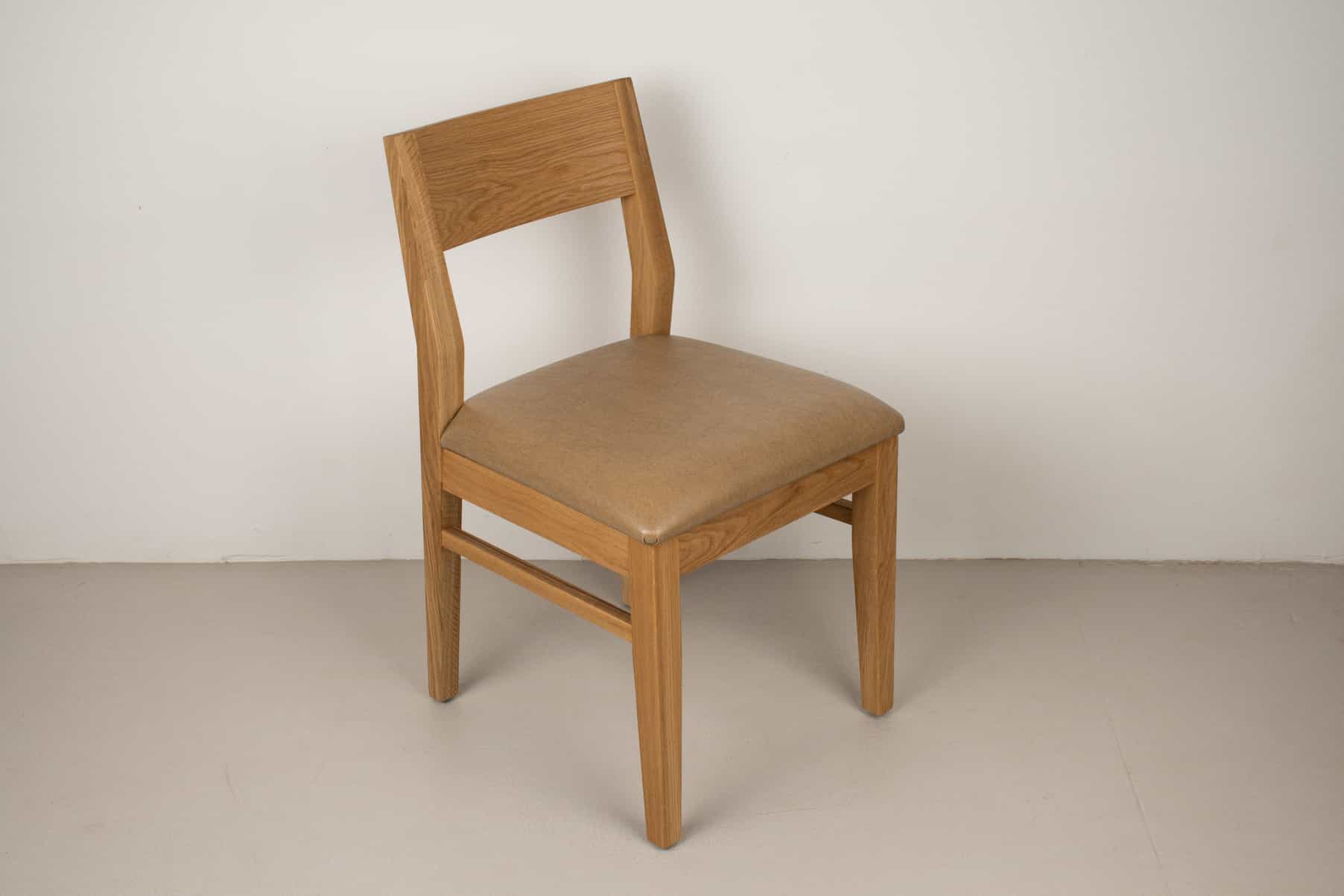 caramel faux leather seat on natural oak chair