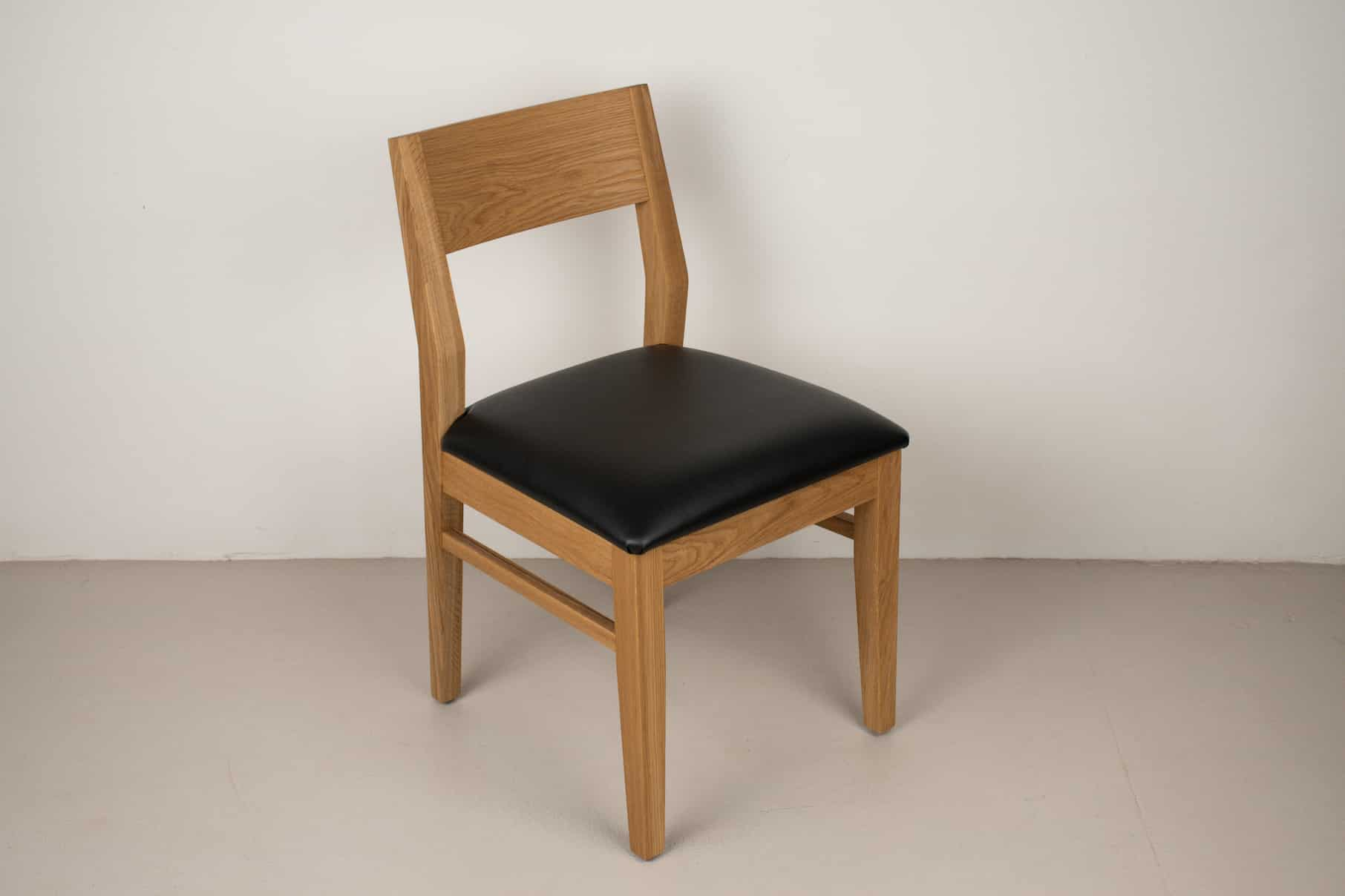 onyx faux leather seat on natural oak chair