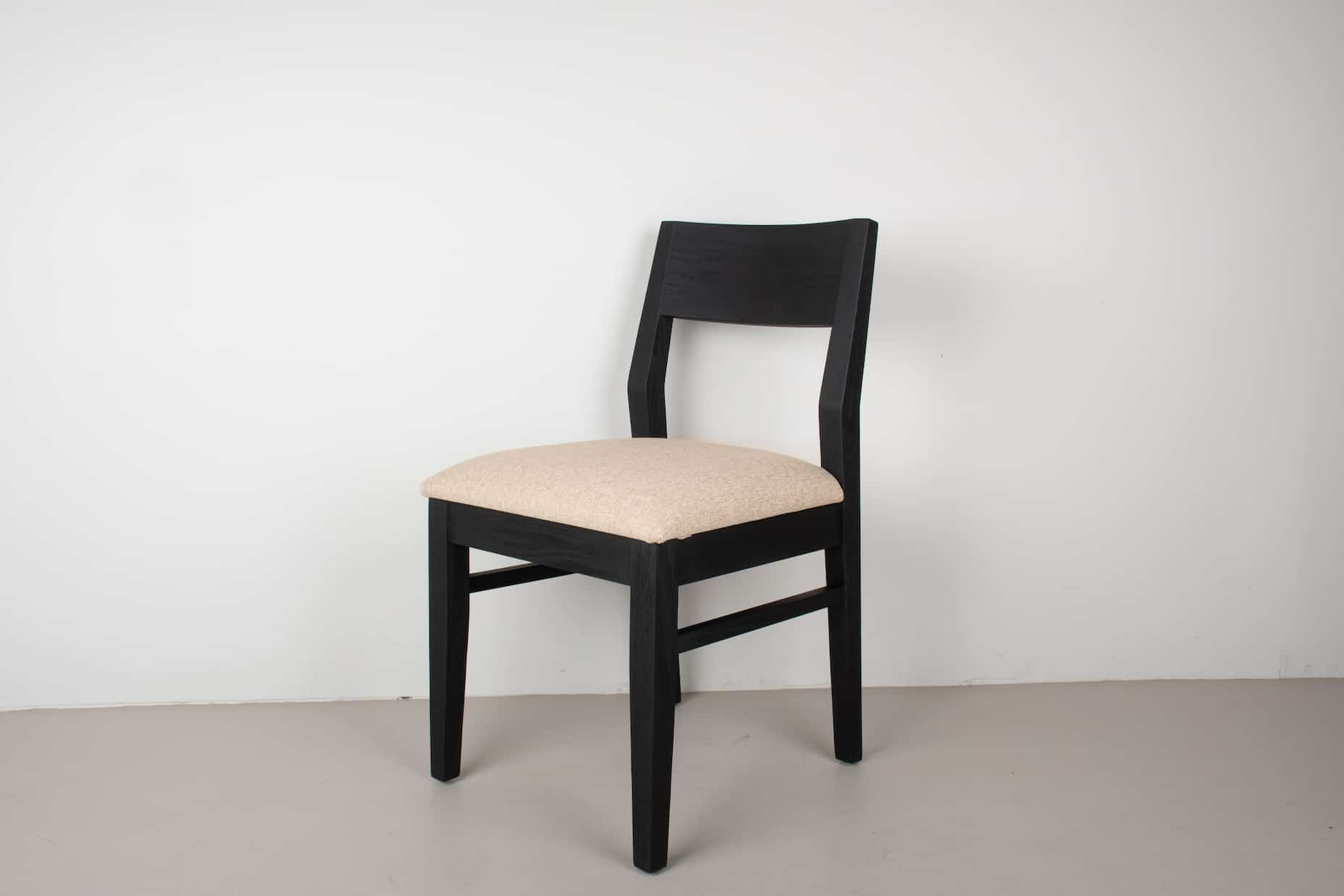 oak Aubrey chair in black with sand cushion