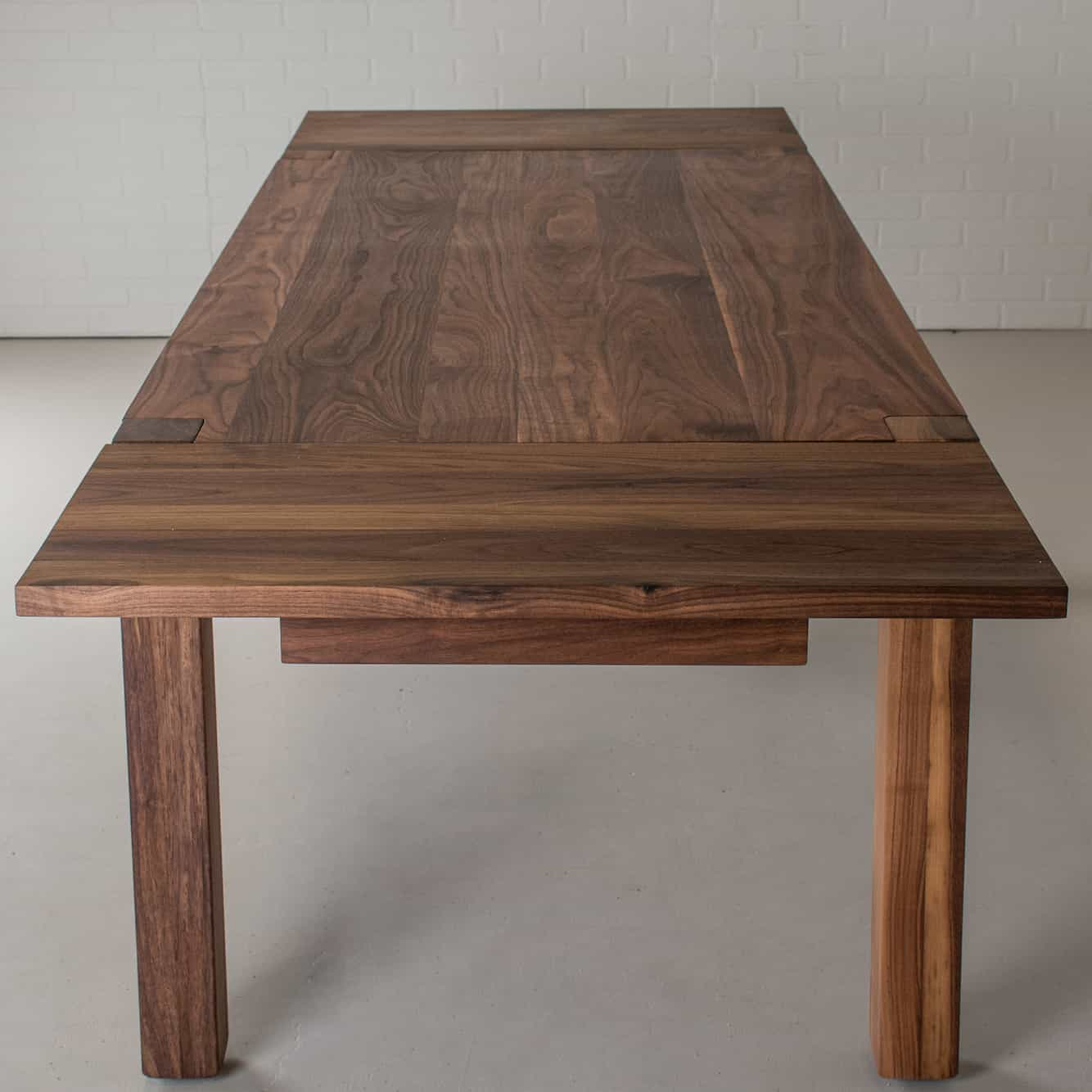 end view of a walnut extension table