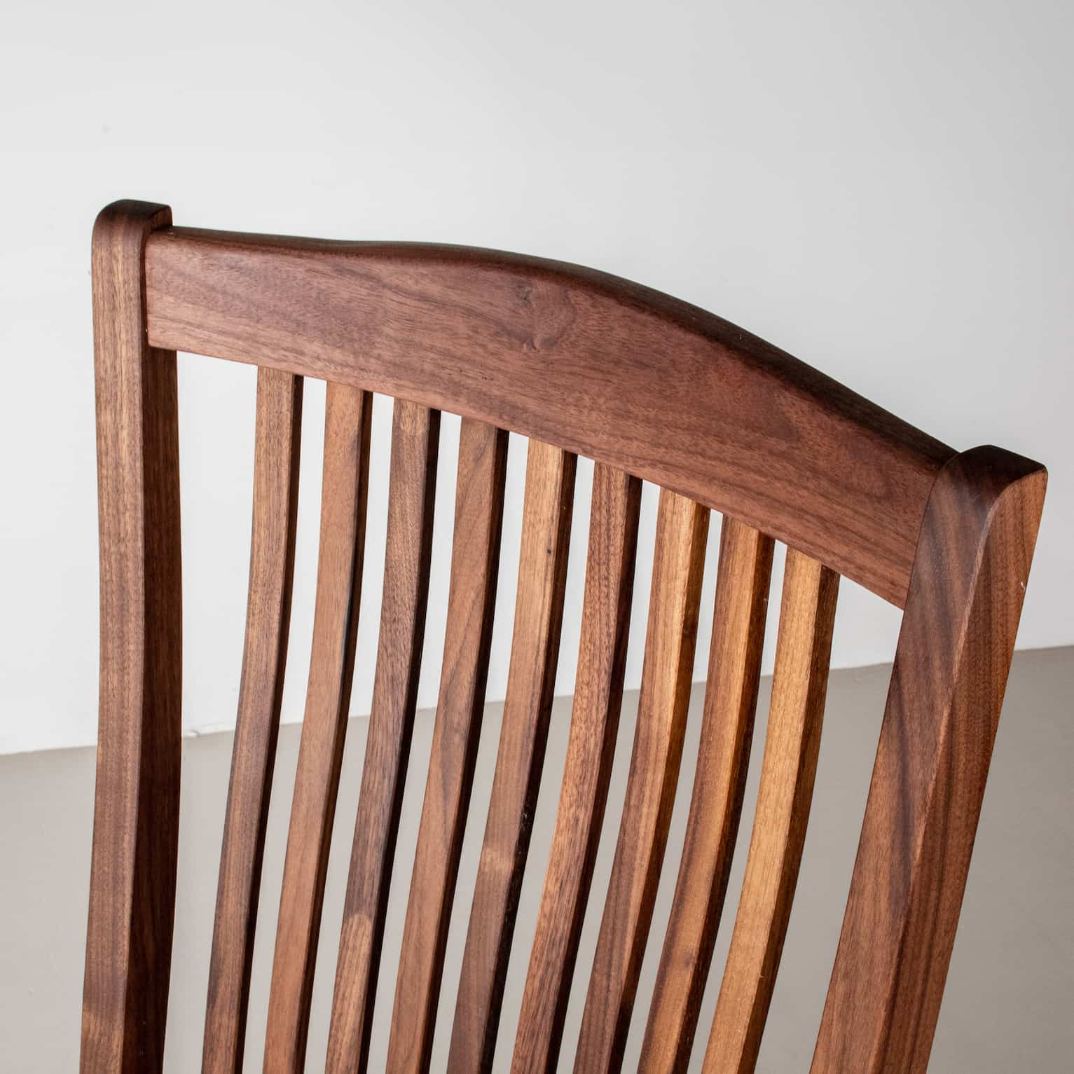 back detail of walnut dining chair