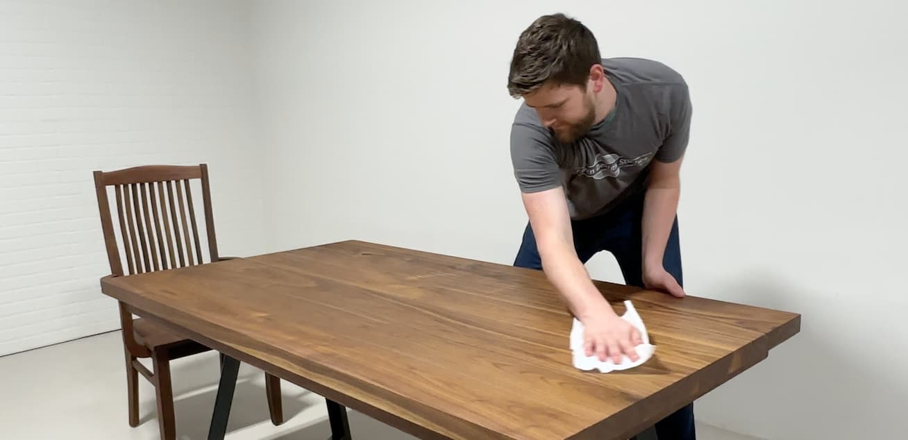 Wiping a Walnut Dining Table