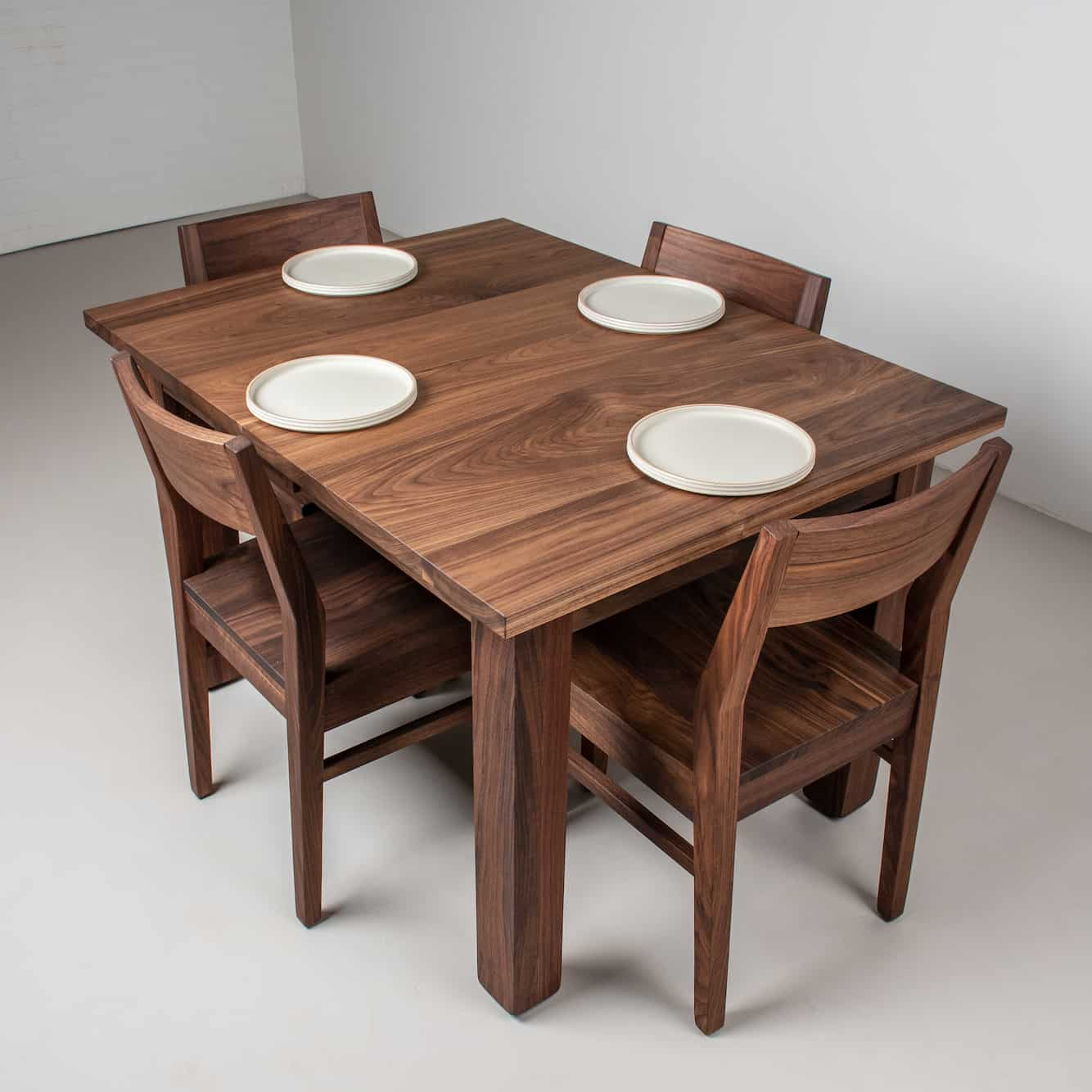 table with no leaves with chairs