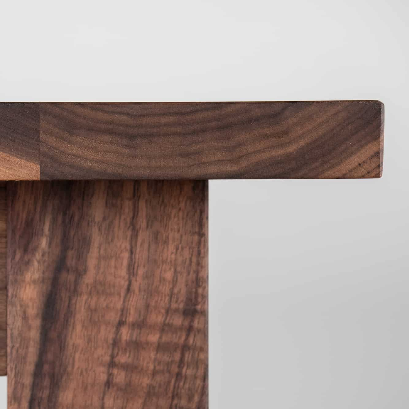 corner detail of walnut parsons table