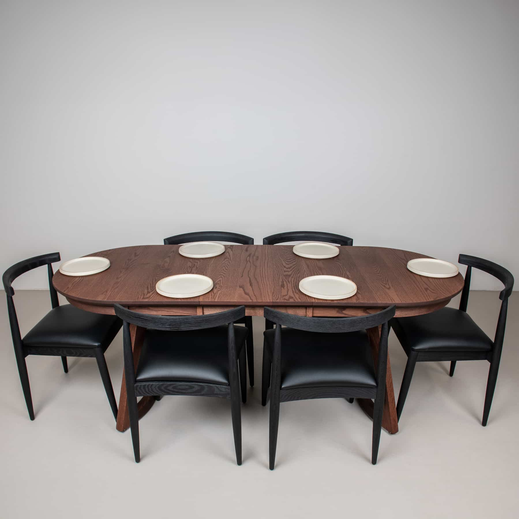 oval table with midcentury dining chairs