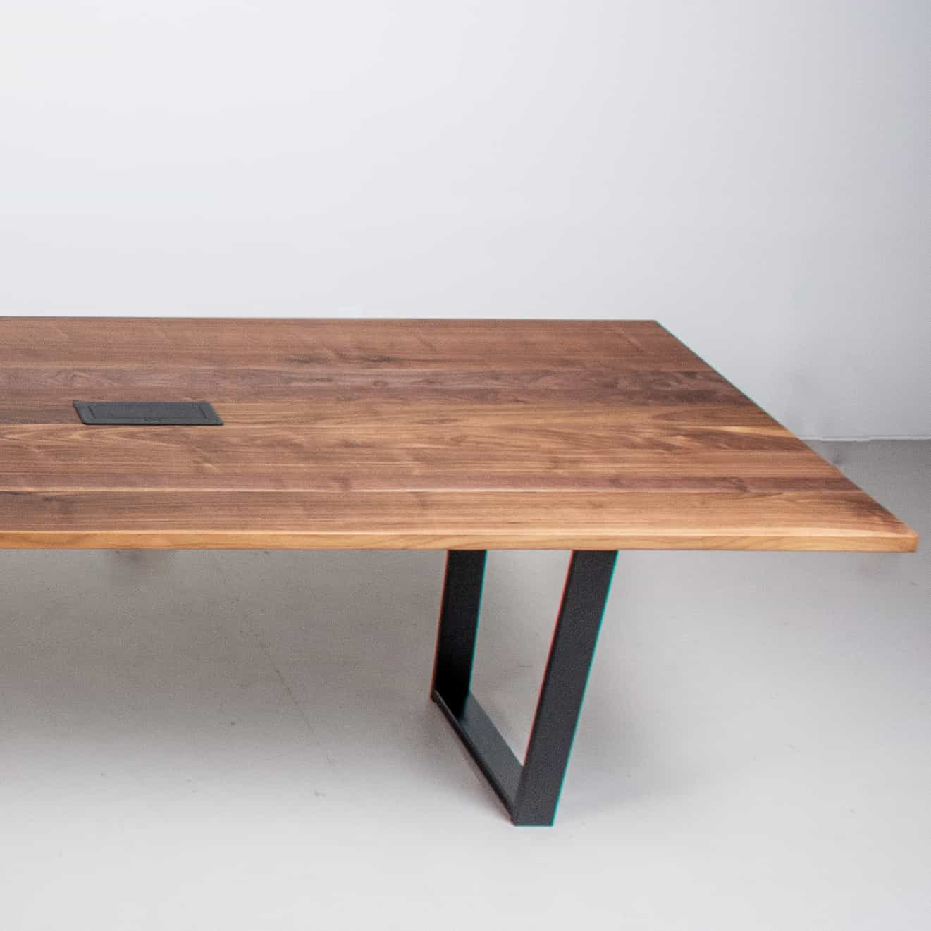 long walnut conference table on steel legs