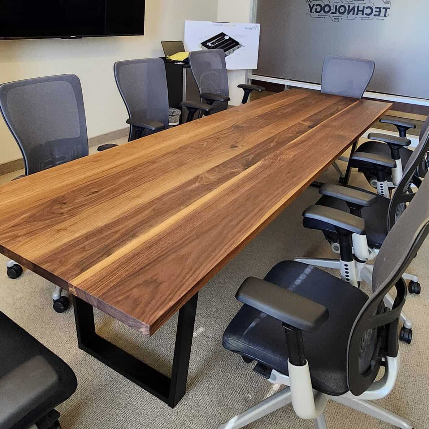 long walnut conference table on steel legs