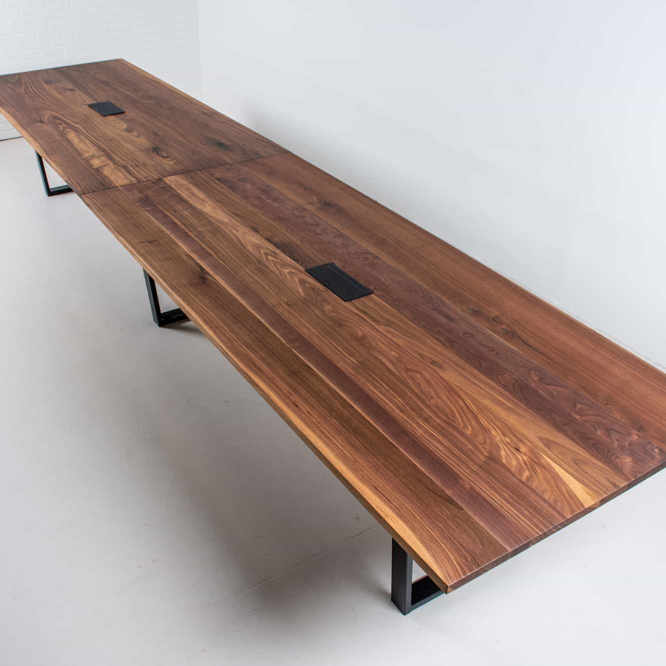 long walnut conference table on steel legs