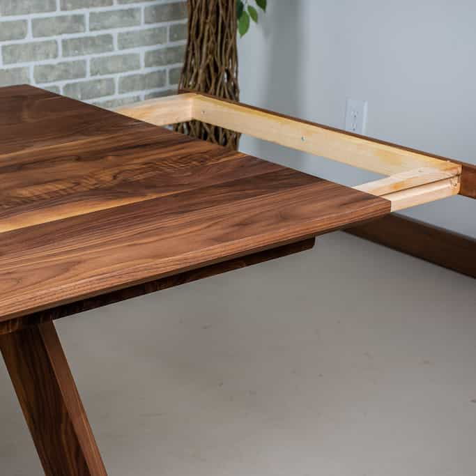 extension detail on a walnut table