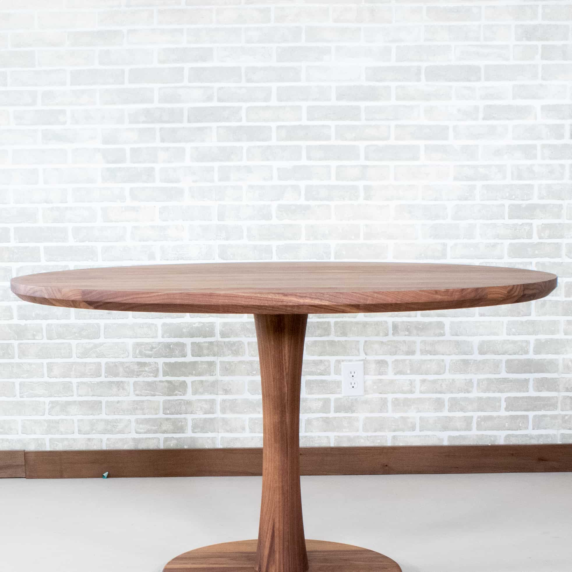 round walnut pedestal table