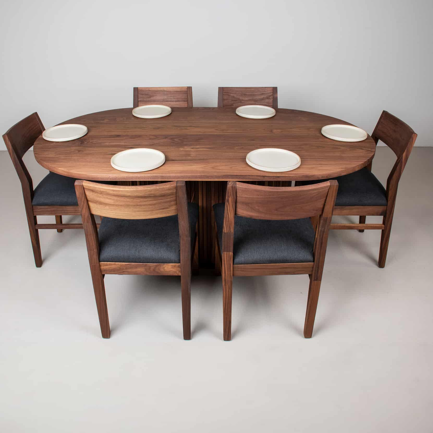 oval walnut table with chairs