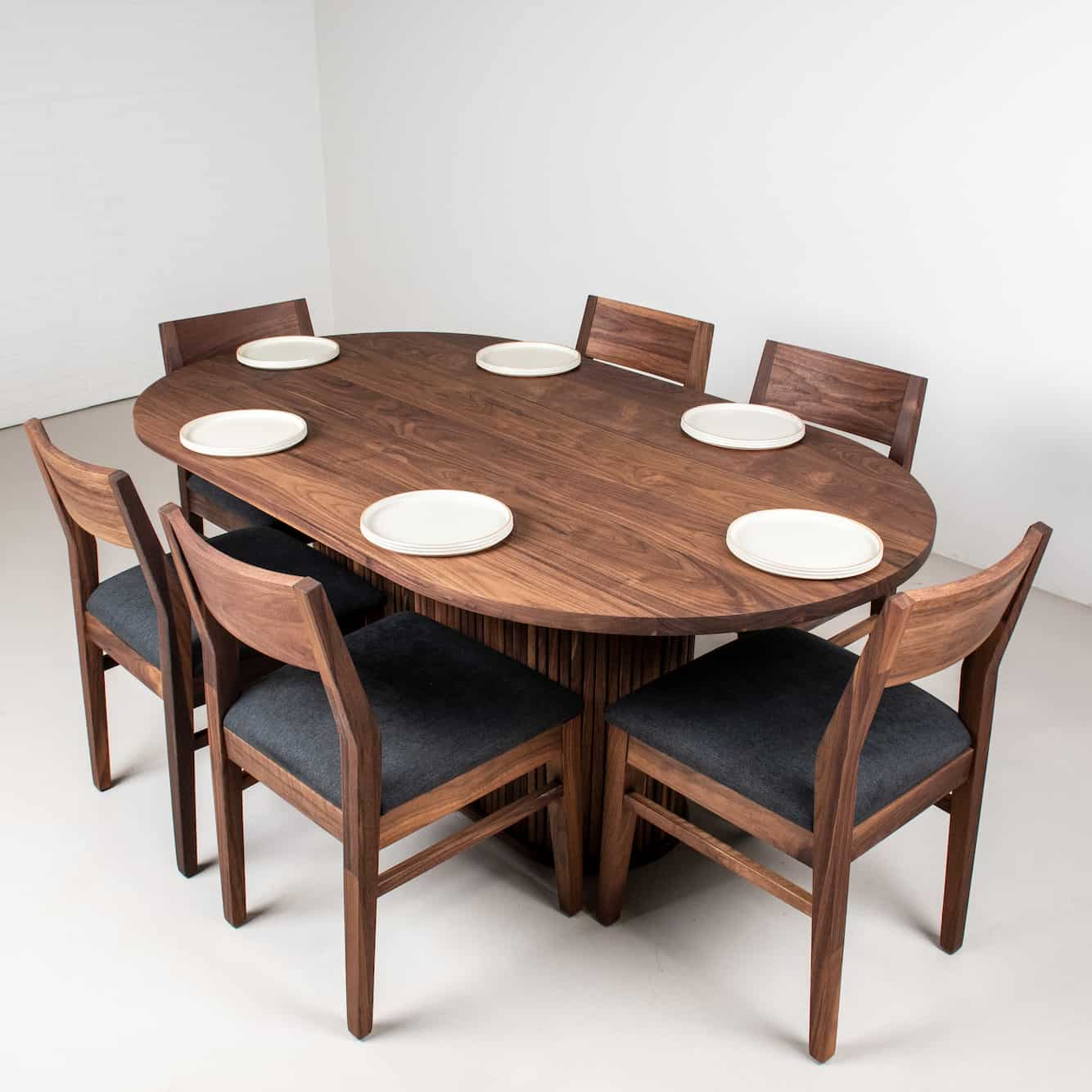 walnut oval table with chairs