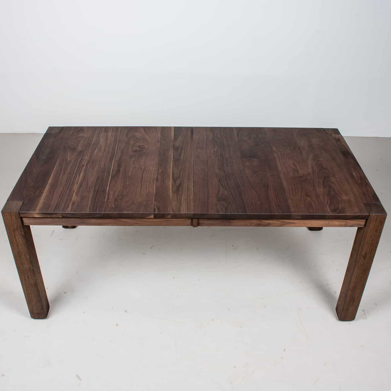 center extension table in blackened walnut