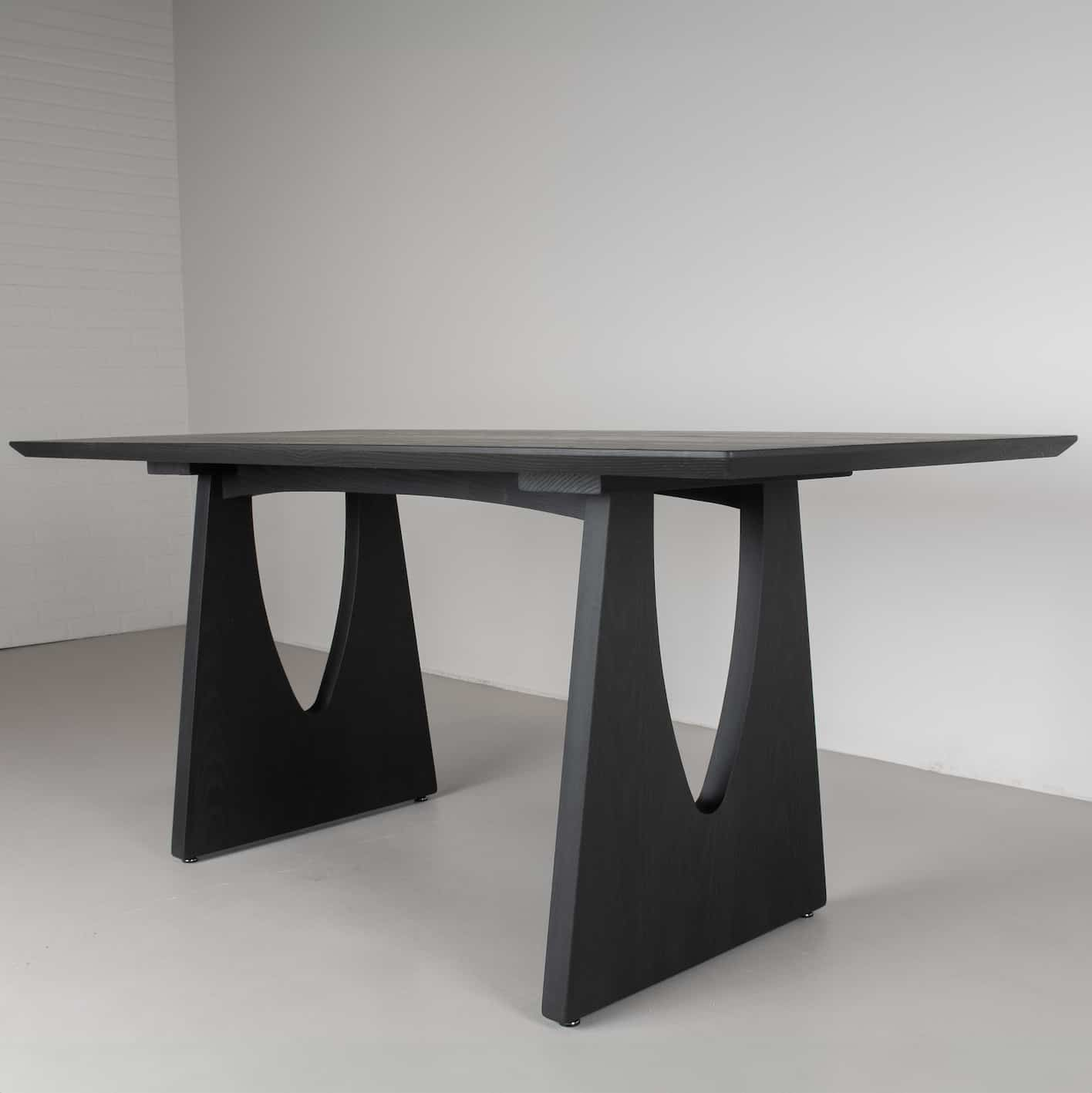 dramatic black ash dining table