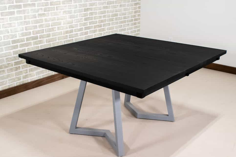 black extendable table on silver legs