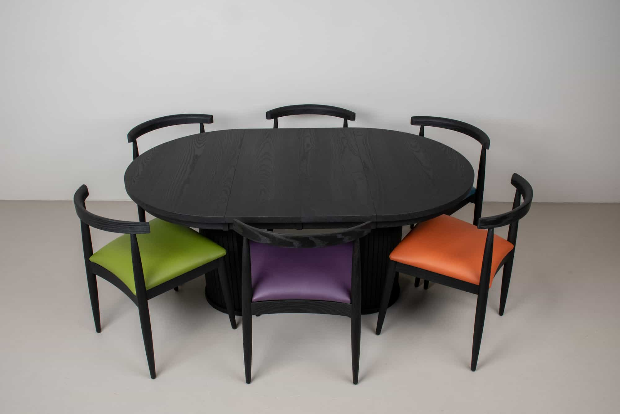 black pedestal table and chairs