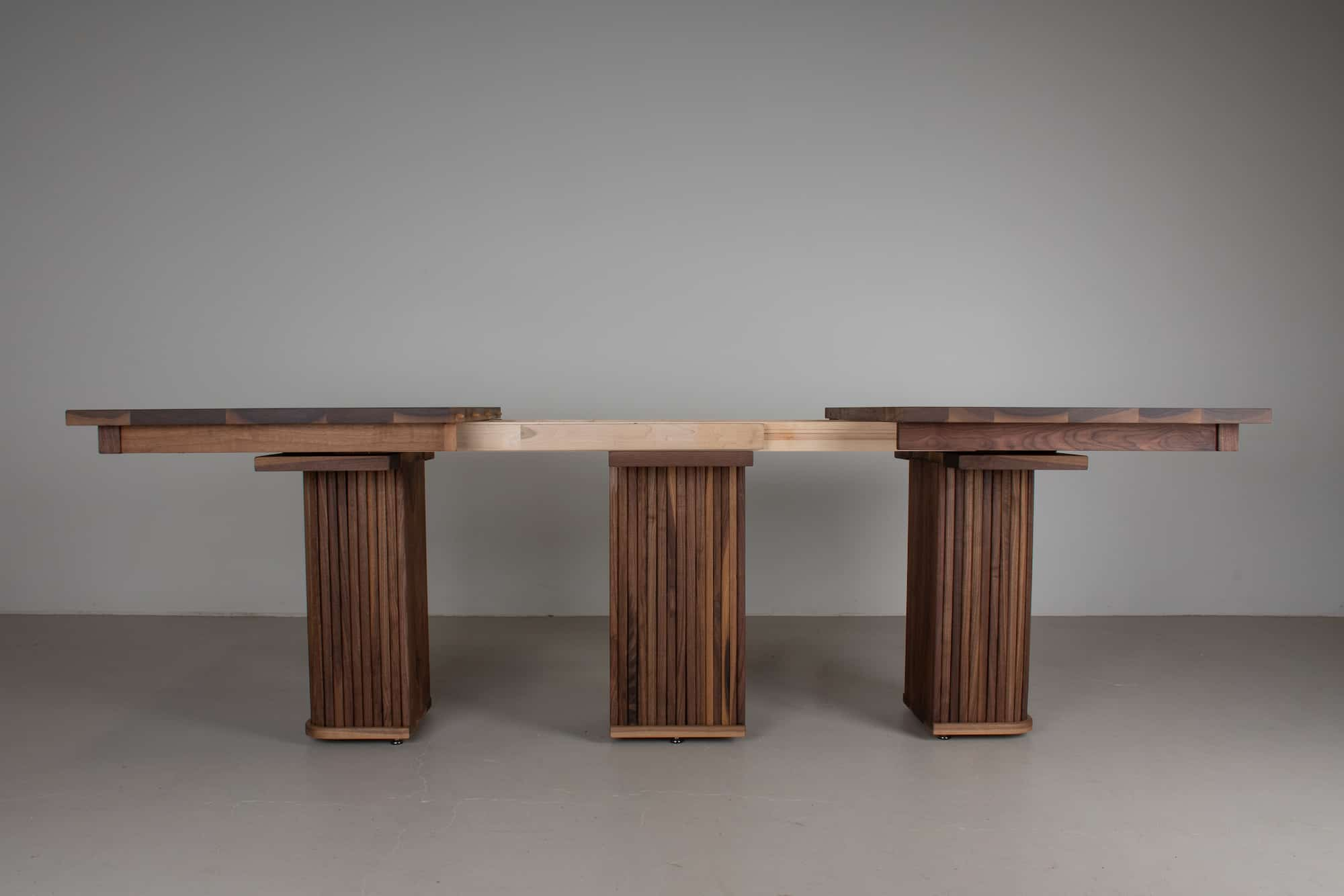 extending pedestal table in walnut