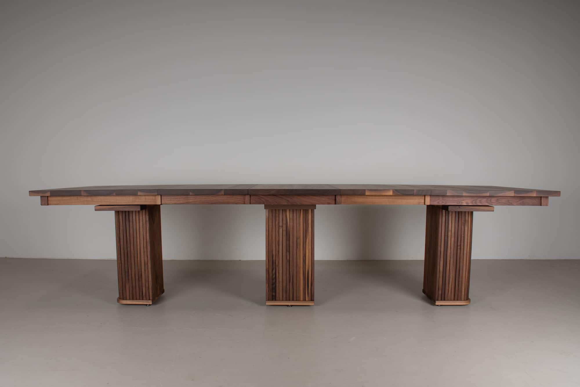 walnut rectangle table on split pedestal base with leaves