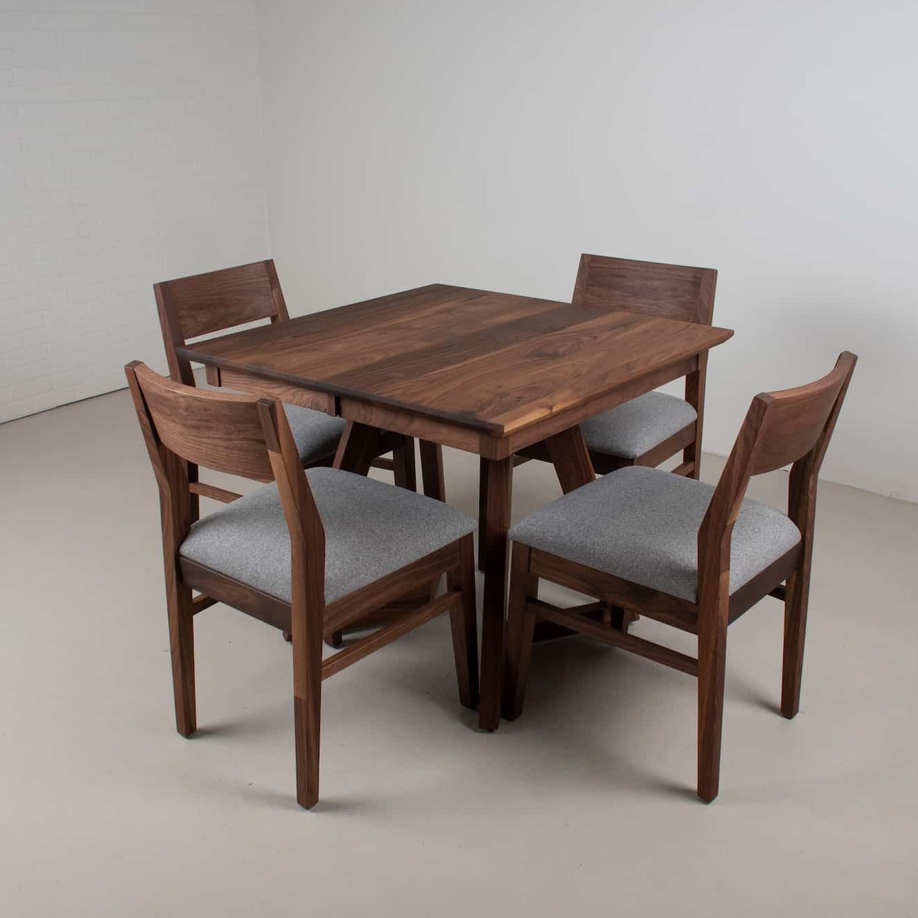 extendable square walnut tab le with chairs