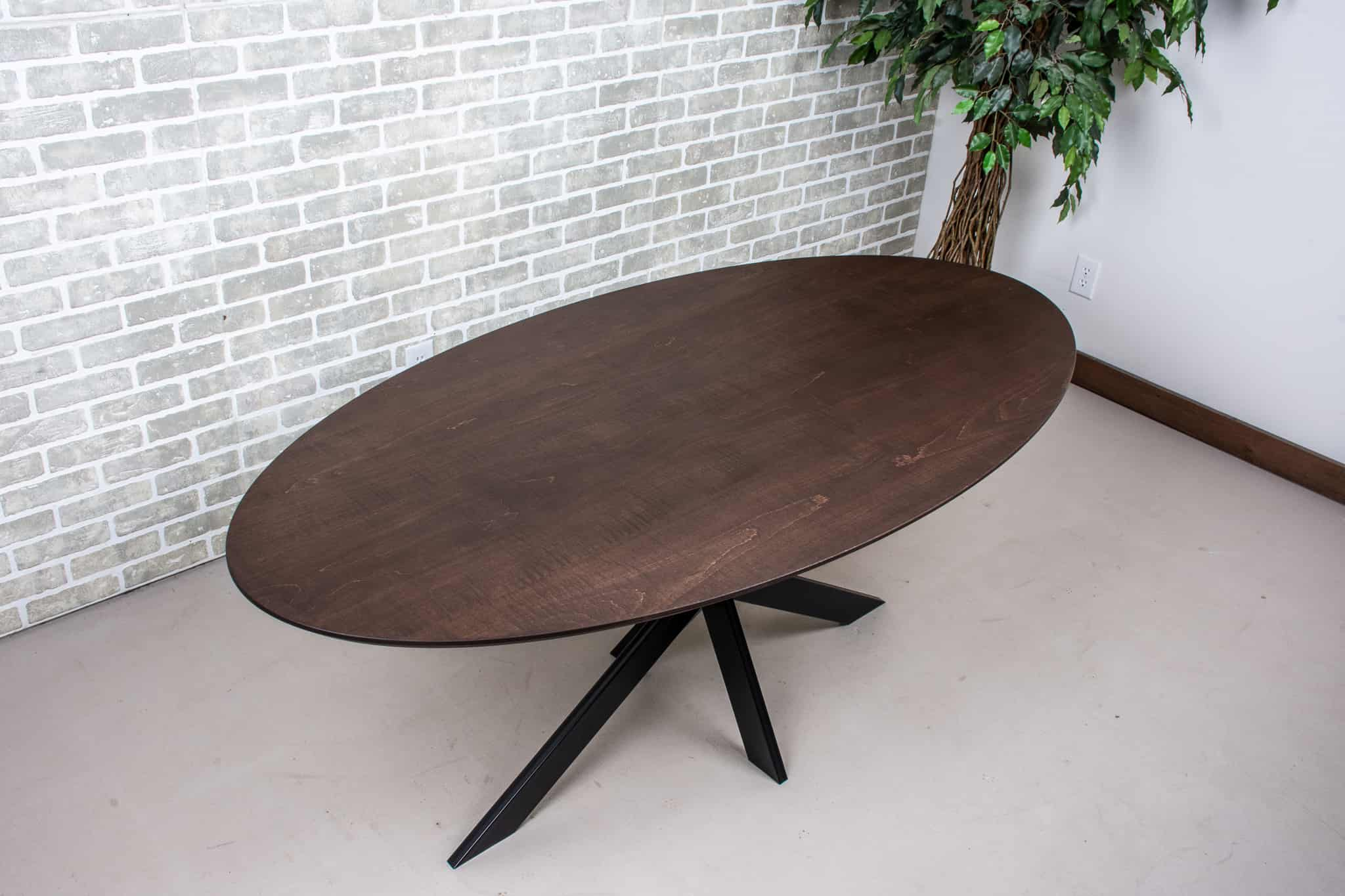 maple elliptical oval table in espresso on starburst base