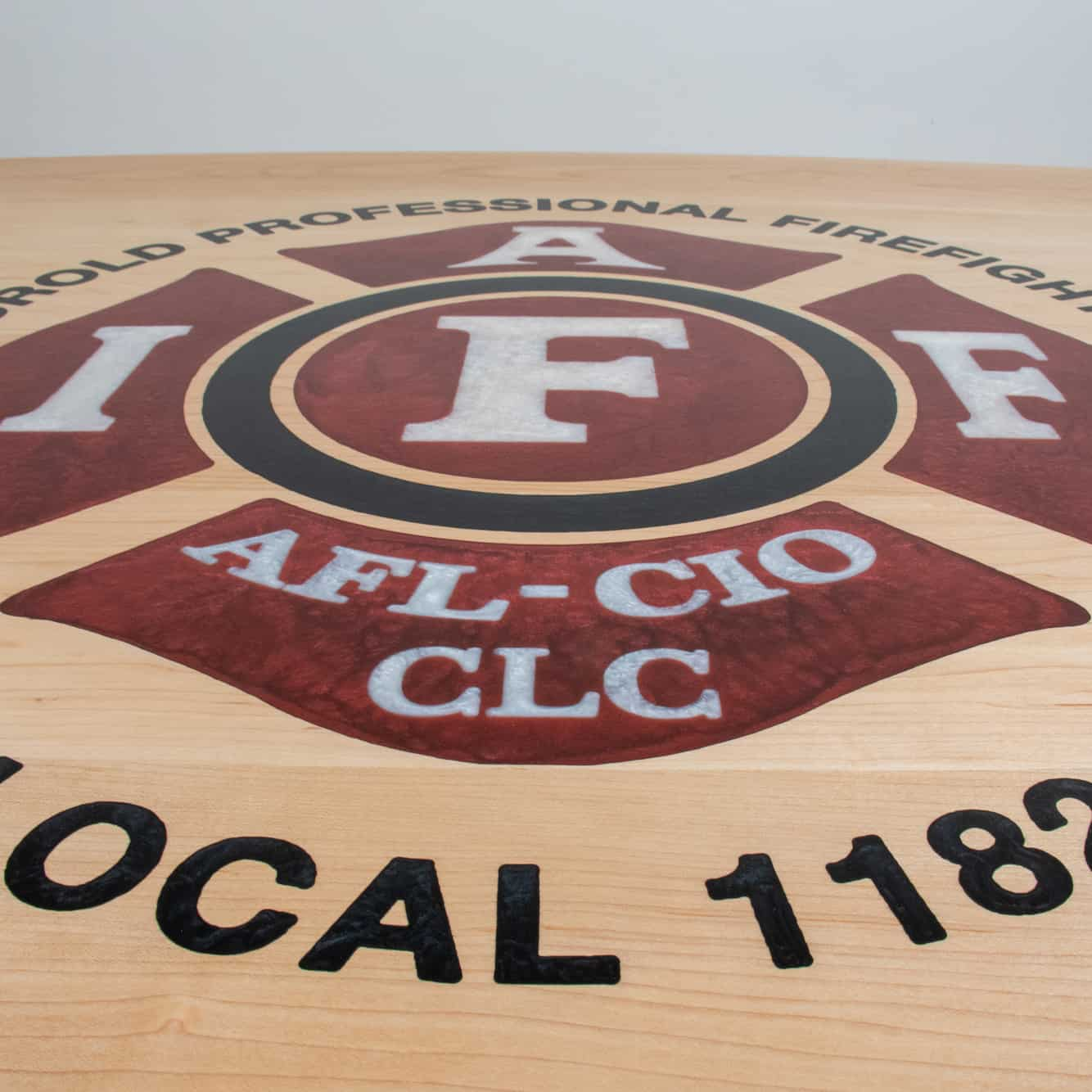 maple table with firefighter logo