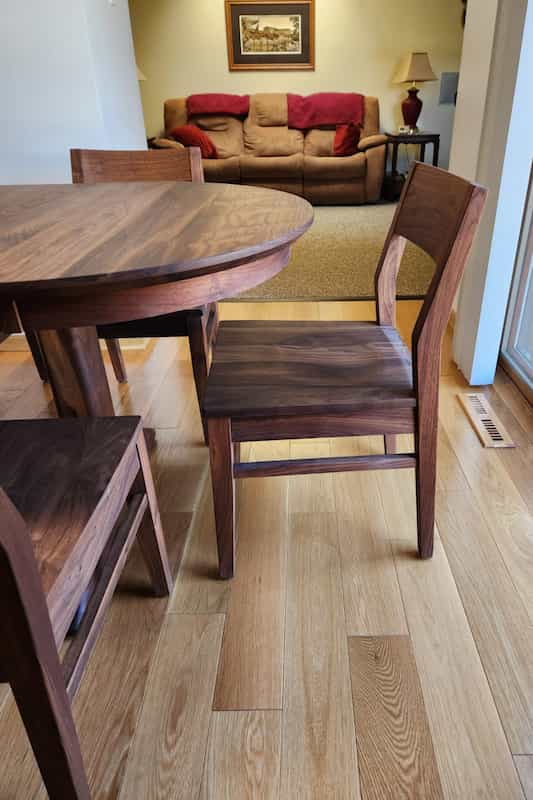 detail of oval extendable kitchen table and chairs