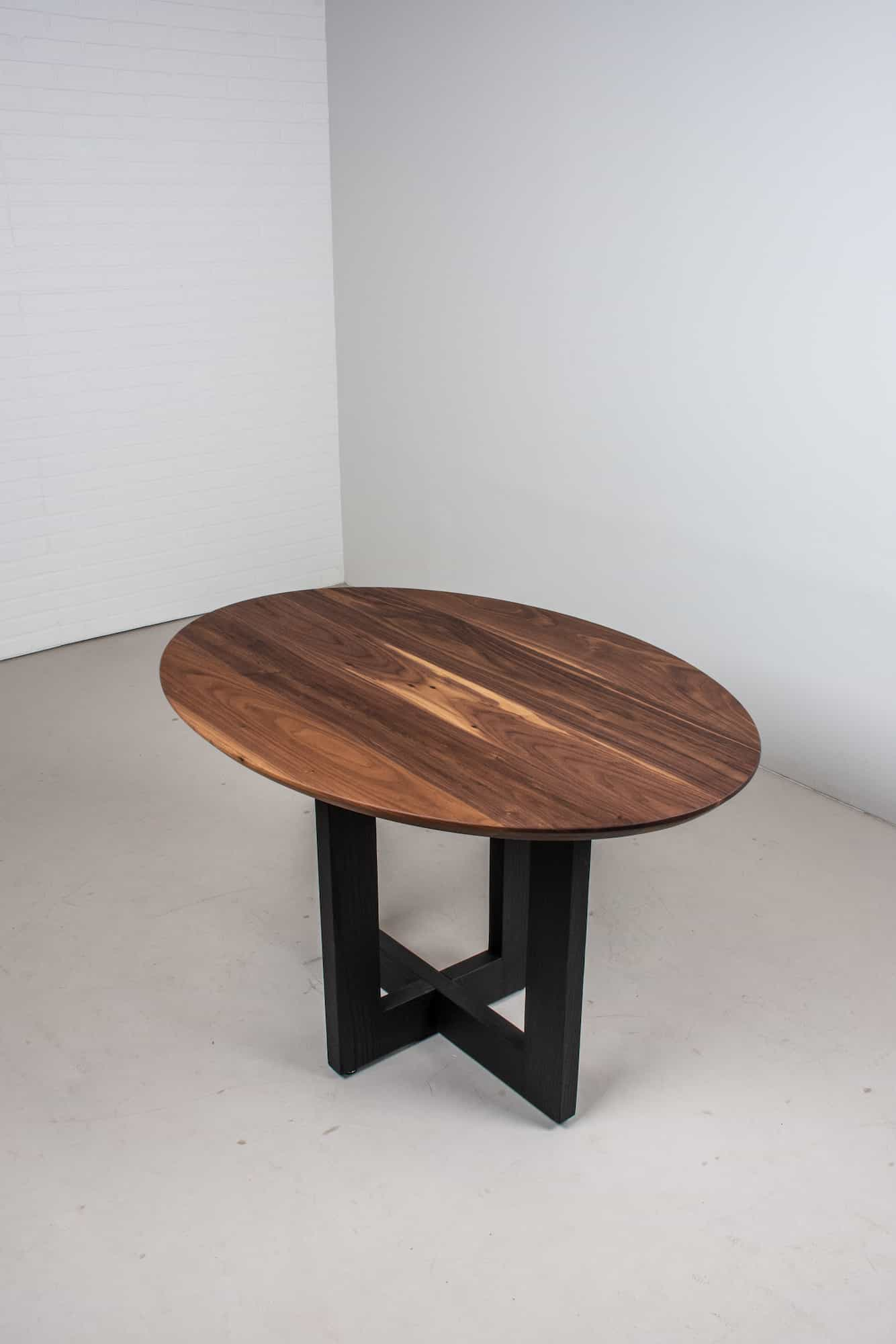 oval table on cross base