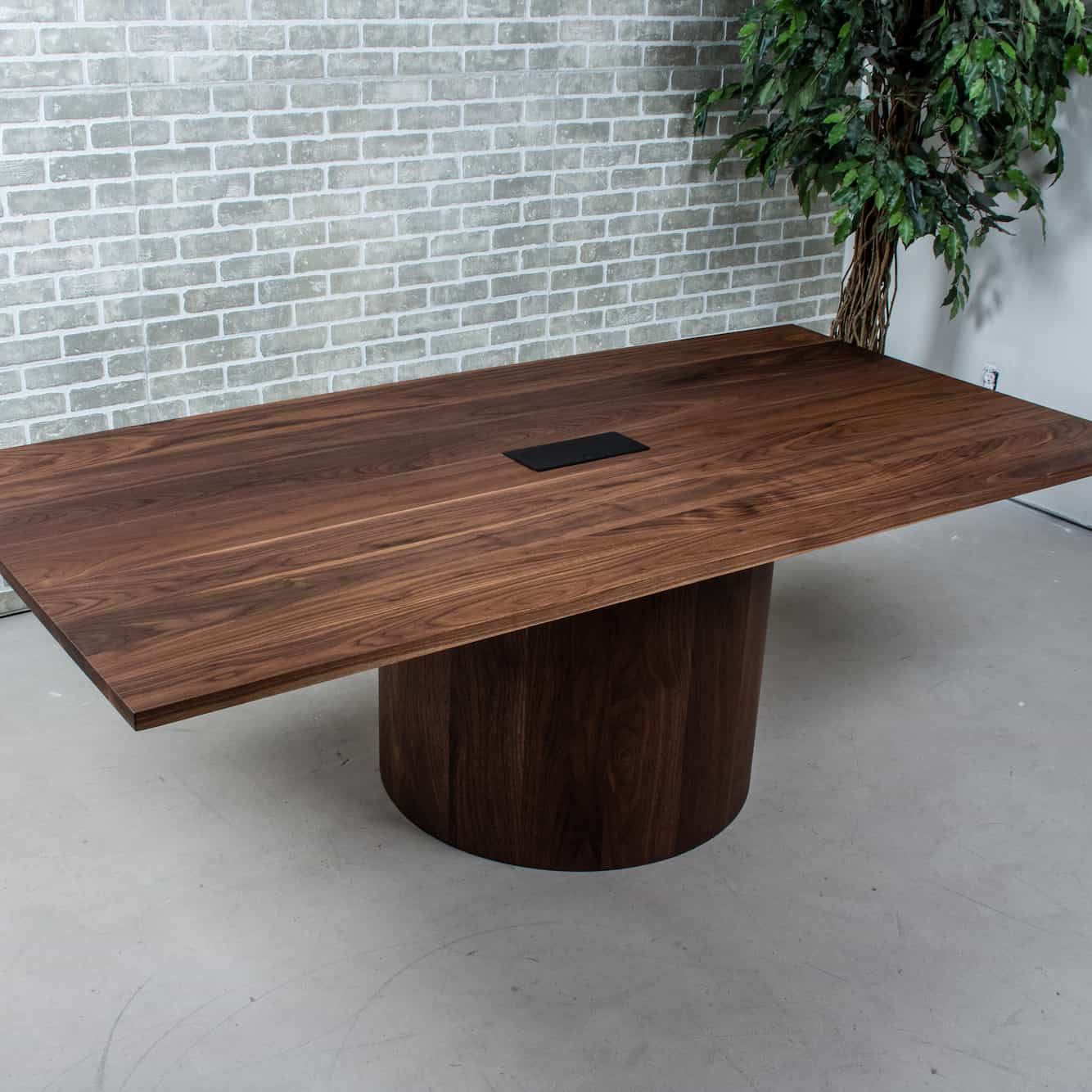 large meeting table on pedestal base