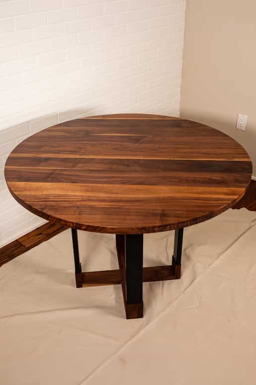 round walnut table on hybrid base