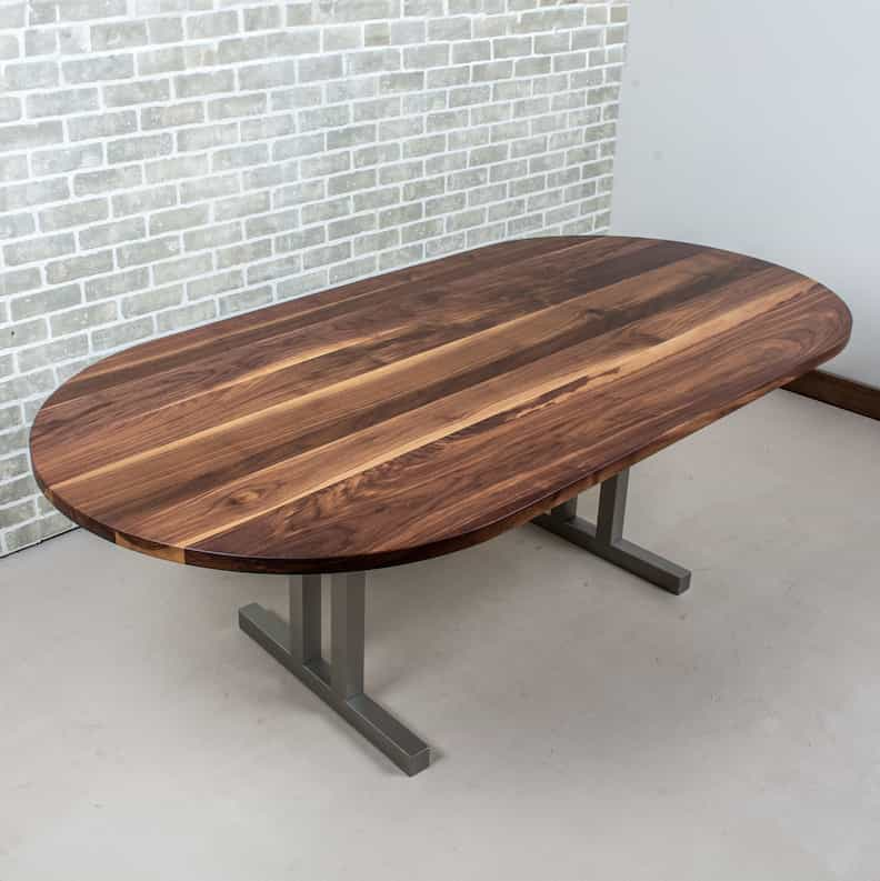 oval wood table on steel legs