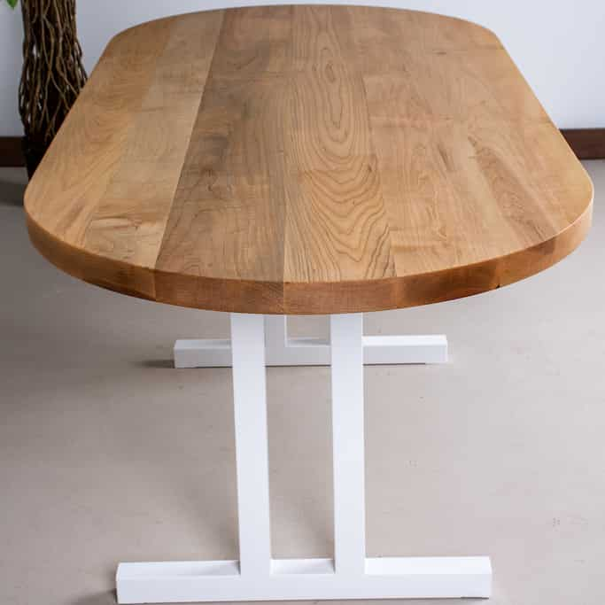 oval wood table on steel legs