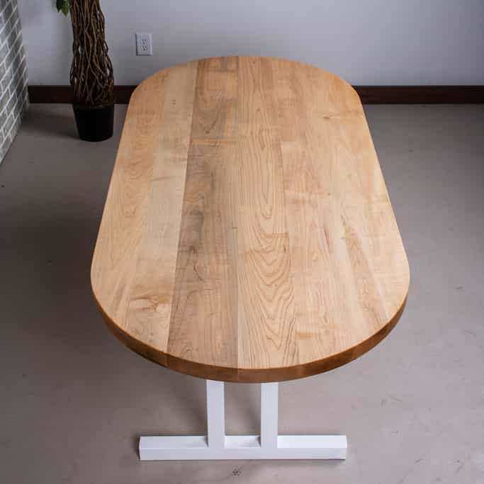 oval wood table on steel legs