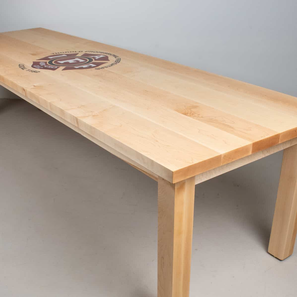 solid maple conference table with epoxy logo