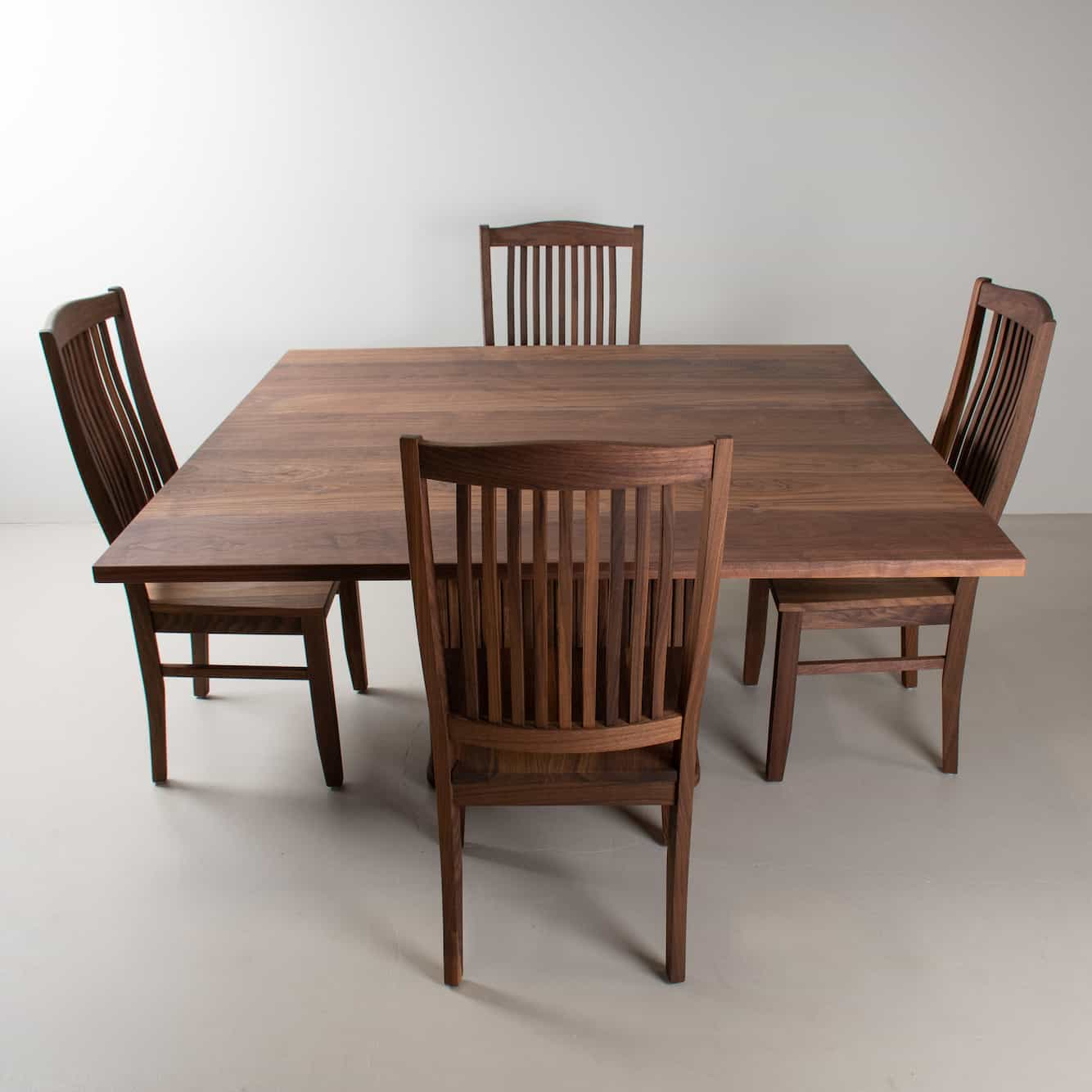 square walnut dining table and chairs