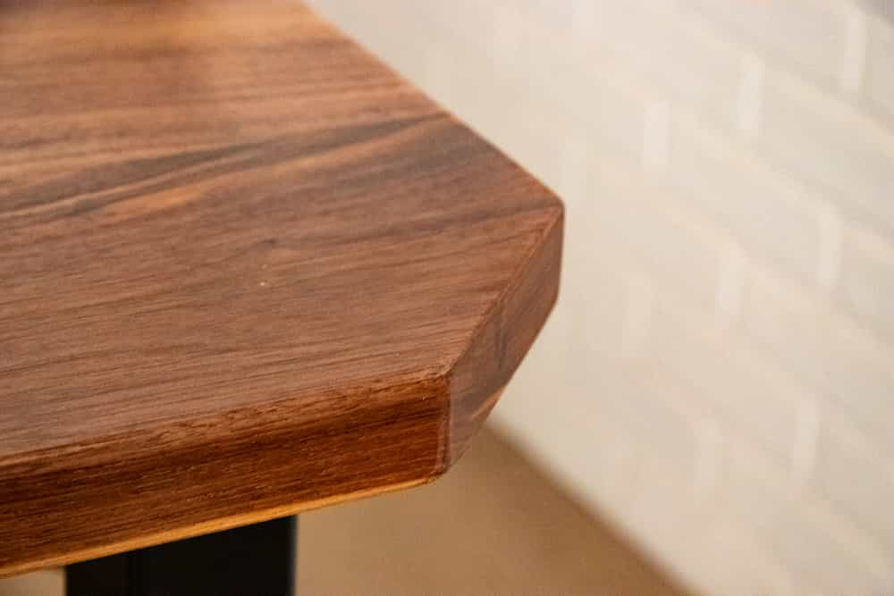 square walnut table with clipped corners