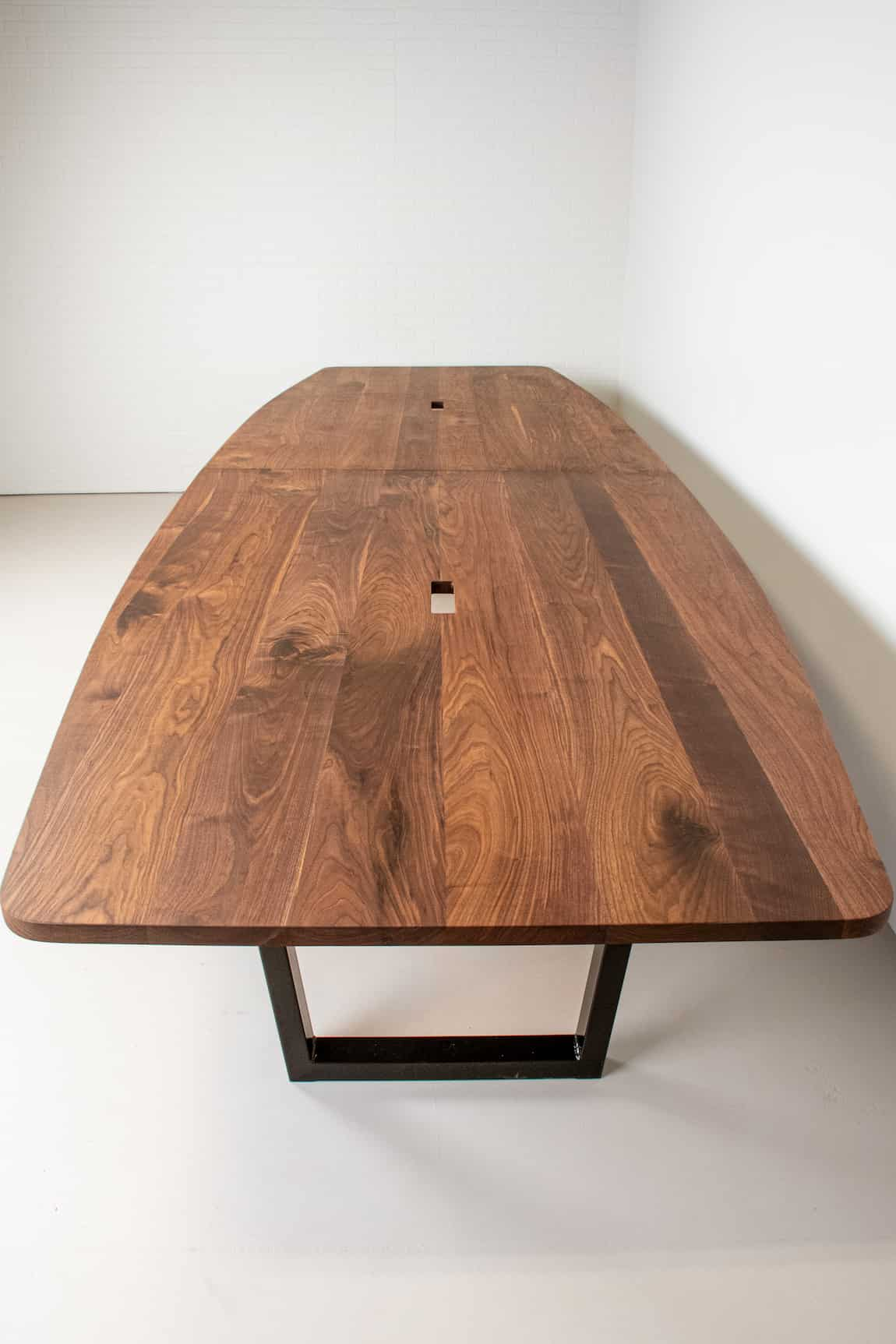 squoval shaped walnut conference table