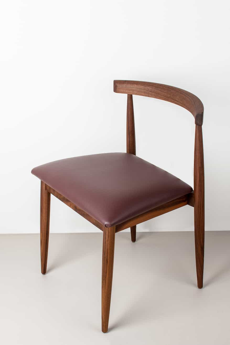 walnut dining chair with faux leather seat