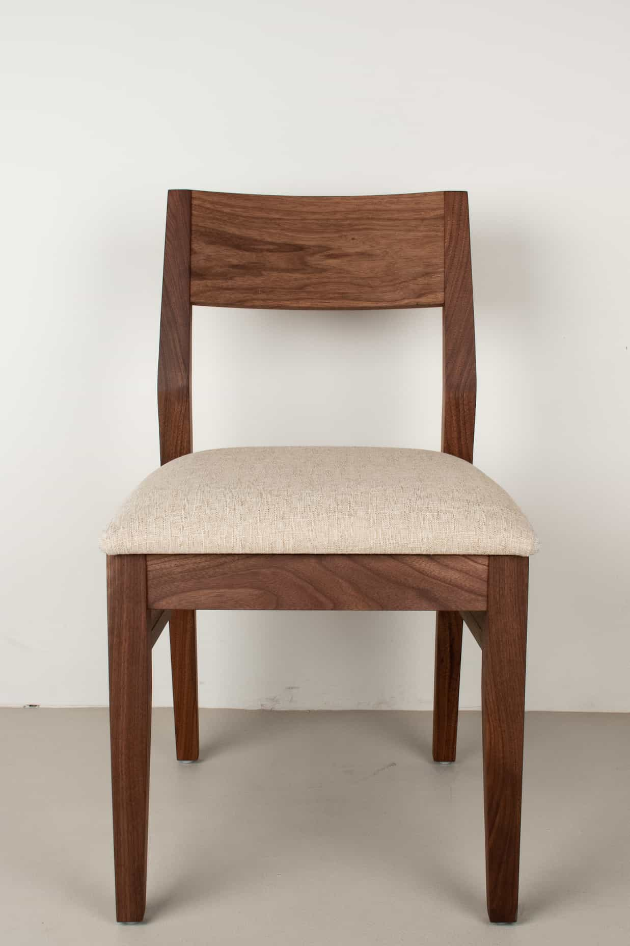 walnut dining chair with fabric seat in sand