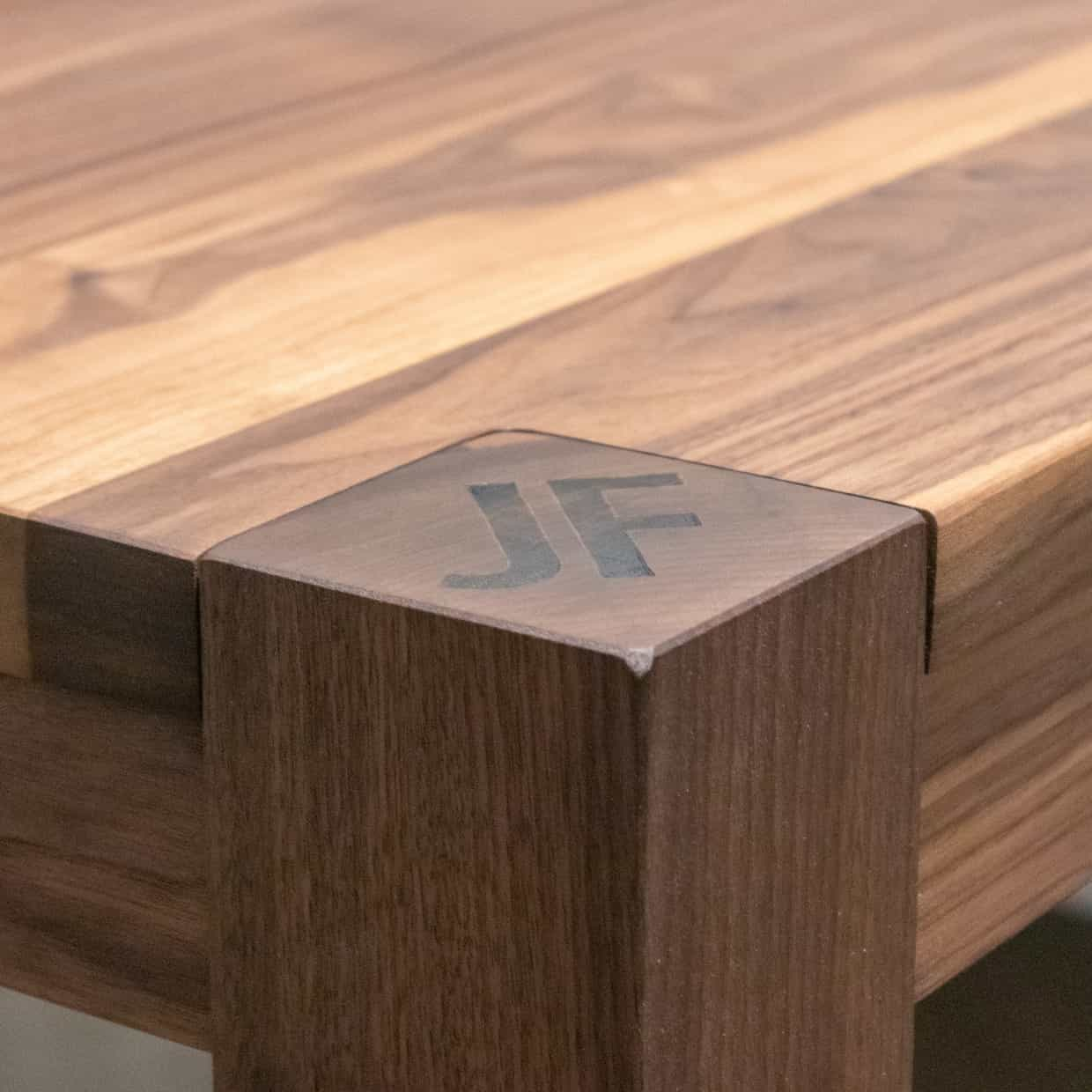 walnut table with engraved corner post