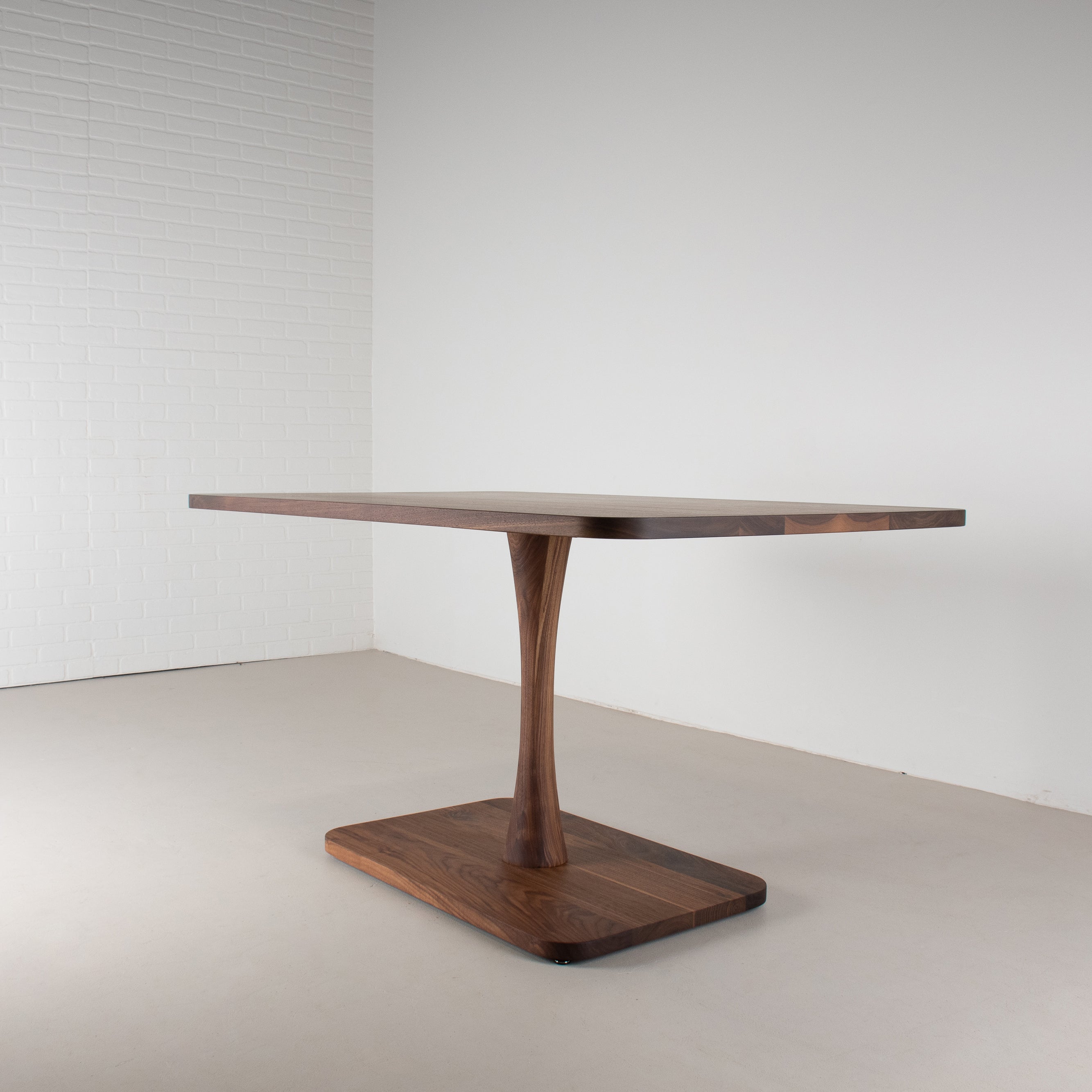 profile view of small pedestal table