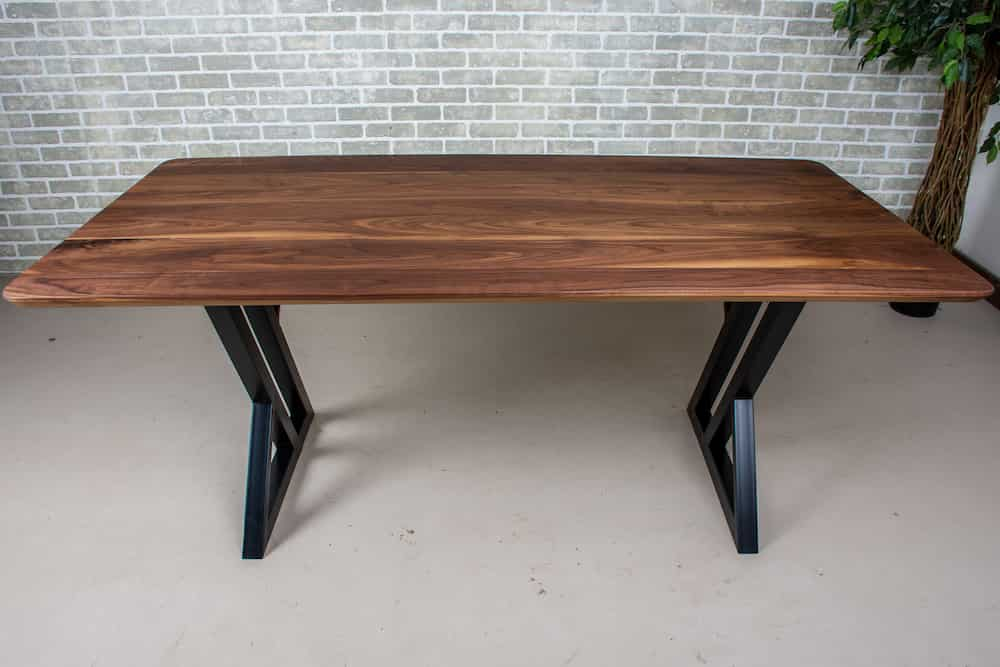 walnut table on black legs