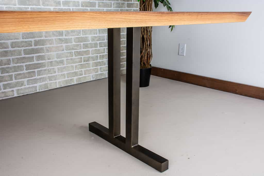 walnut table on bronze legs