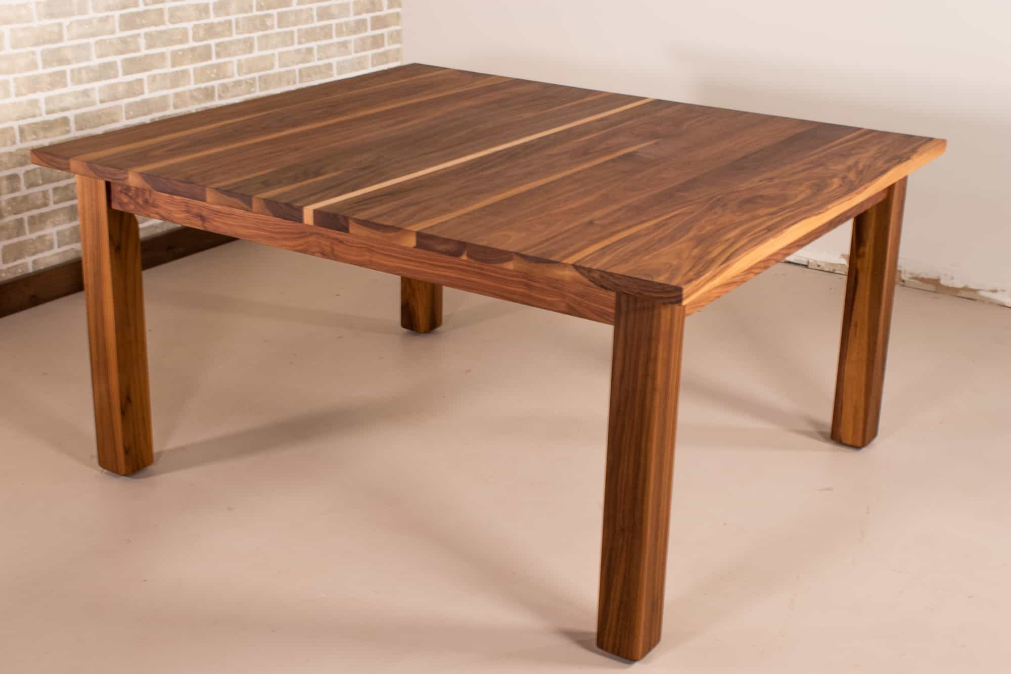 https://www.loewendesignstudios.com/cdn/shop/products/biscaynesquarewalnutparsontable3.jpg?v=1678823499